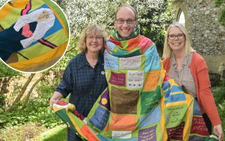 Sally-Anne Lomas, creative director and founder of the Cloth of Kindness, with Gill Perks, project manager, and the Reverend Richard Stanton, priest director of the Julian shrine