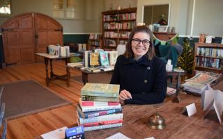Lucie Riches at the headmaster's desk in the Old School Bookshop she has opened in Old Buckenham Picture: Denise Bradley