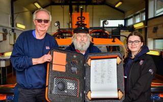 From left Derek Greening, Geoff Needham and Louise Kyle after signing the RNLI's Connecting our Communities scroll at Hunstanton lifeboat station